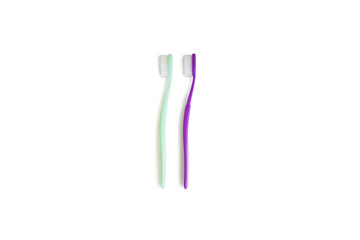 Two toothbrushes over white background