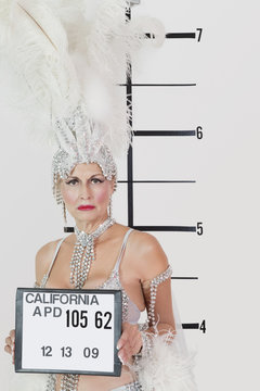 Mug Shot Of Senior Showgirl Holding Plaque