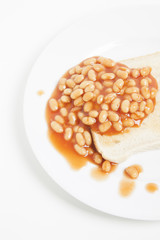 Baked beans and bread in plate