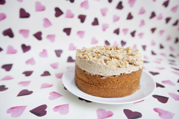 Close-up of birthday cake over heart shaped background