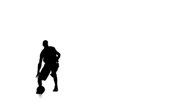 Basketball makes a feint, and stuffing the ball. Silhouette. White background