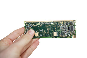 Close-up view of hands holding computer circuit board over white background