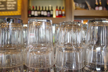 Upturned glasses at a pub counter