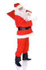Santa Claus standing with his sack full of presents, isolated on white background. Full length portrait
