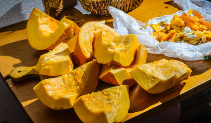 Chunks, cut a large pumpkin on the table.