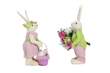 Stuffed toys portrayed as male with flowers and female with basket over white background