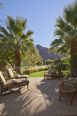 Patio with relaxing chairs and gardens 