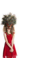 Portrait of girl in red outfit wearing peacock mask over white background
