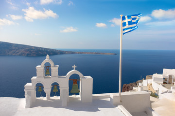 Bell tower on Oia village and caldera on Santorini island