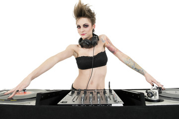 Portrait of beautiful young female DJ wearing strapless lingerie over white background