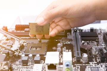 Assembling high performance personal computer, inserting CPU, pr