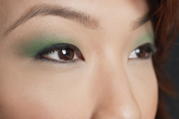 Obraz premium Cropped image of Asian woman looking away