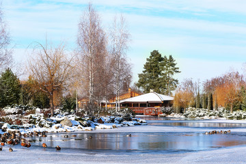 Beautiful park with lake on winter day