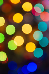 Lights blurred bokeh background from christmas night party for your design, vintage or retro color toned