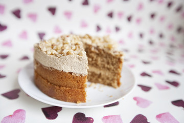 Close-up of cake with missing piece over heart shaped background