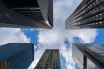 Fototapeta na wymiar Looking up at a few impressive skyscrapers in Chicago