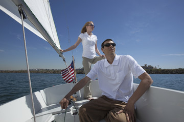 Young couple sailing in boat