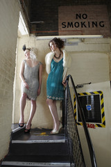 Full length of two beautiful young women waiting backstage