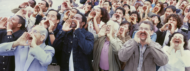 Panoramic shot of crowd shouting with hands on face