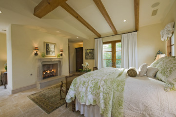 View of bedroom with fireplace