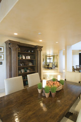 Wooden dining table and cabinet in dining room