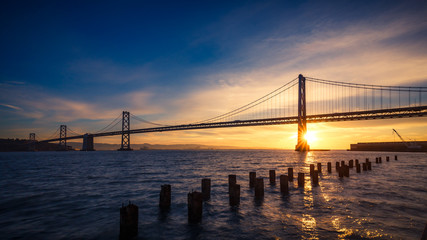Fototapeta na wymiar San Francisco Bay Bridge at Sunrise