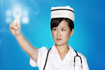 Female nurse using futuristic touch screen over blue background