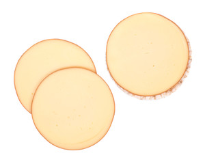 Sliced amish farm organic smoked gouda cheese and organic brown rice cake isolated on white background