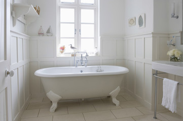Naklejka na ściany i meble Freestanding bathtub in bathroom