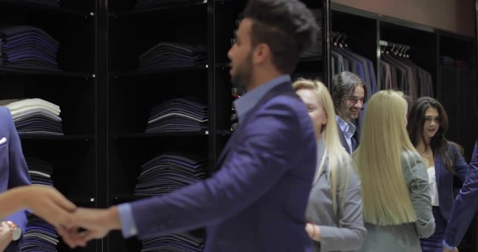 Business Man Trying Jacket Fashion Shop, Customer Choosing Clothes Retail Store, Shopping Seller Woman Formal Wear Slow Motion 60 Fps