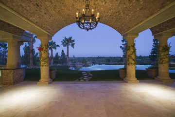 Scenic view of landscape and pool through arched structure
