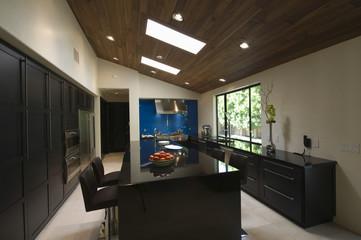 Breakfast bar in modern kitchen with skylights