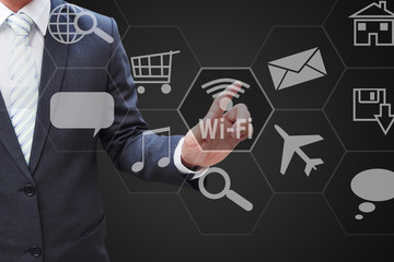 Businessman hand touching virtual panel of icon polygon interfac