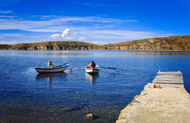 Fototapeta na wymiar Lake Titicaca Bolivia beautiful bay with fishing boats