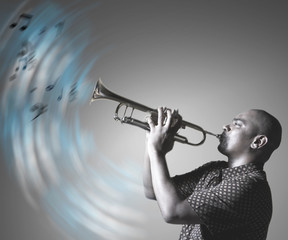 Man playing trumpet and making music © MDBPIXS