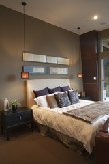 Pendant lights in bedroom with silk furnishing