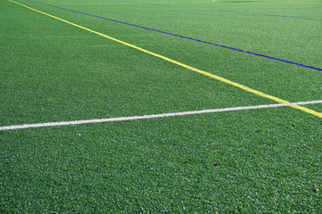 Obraz premium close up on football field with green artificial grass