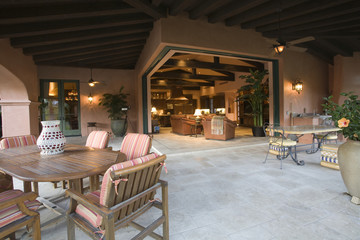 Spacious sitting area with living room in the background at home