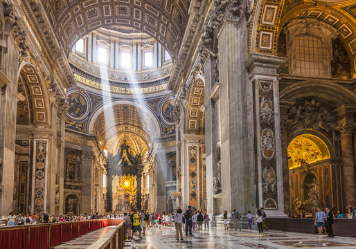 Interior of St. Peters Basilica with light shafts coming through the dome roof, Vatican City, Rome, Lazio