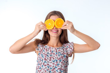 girl with orange slices in hands