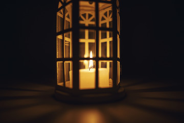 lantern with a candle in a dark background