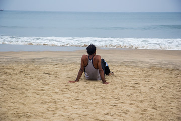 Adult man alone looking at the ocean
