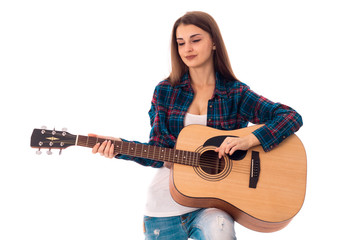 brunette girl with guitar in hands