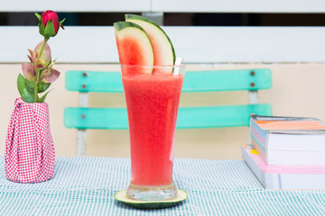 red water melon in glass on food table