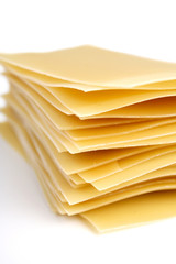 Lasagne raw pasta on white background