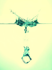 Green Ice cubes splashing