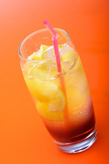 Studio shot of drink on orange background