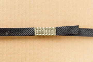 Plastic poly strap with metal clamp