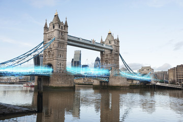 Fototapeta premium Blue streak of lights passing through London Bridge