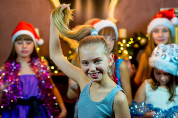 Group of young girls celebrating Christmas. First plan